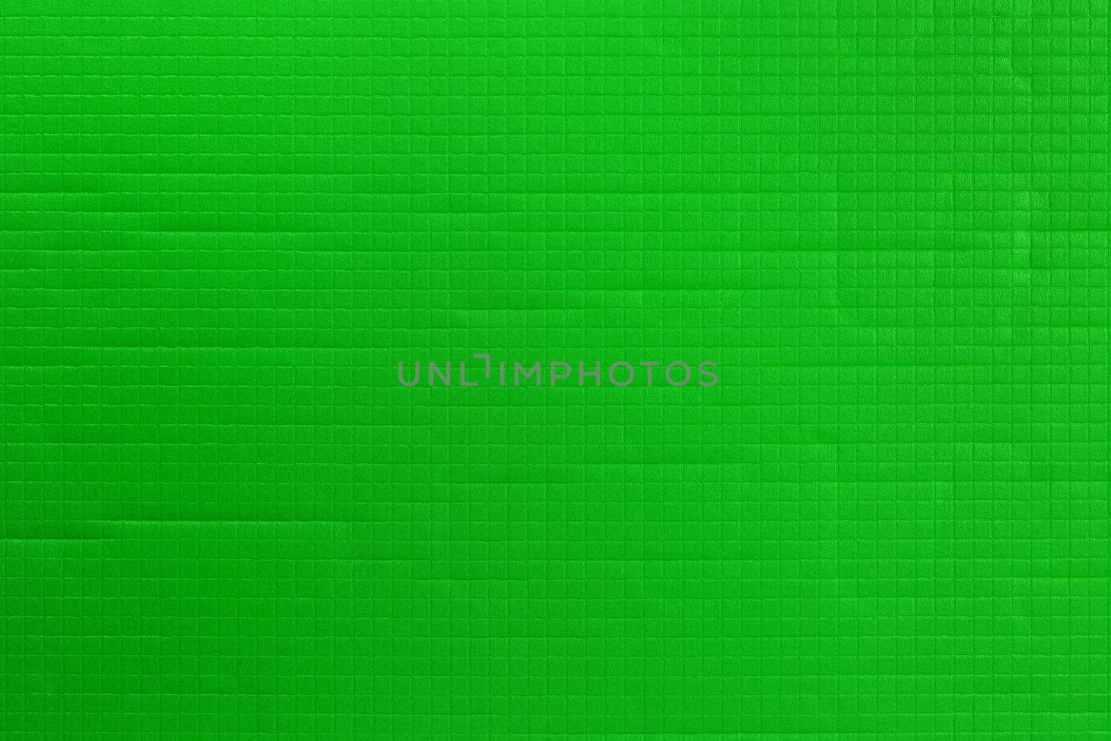 green sport or yoga foam mat surface flat texture and background.