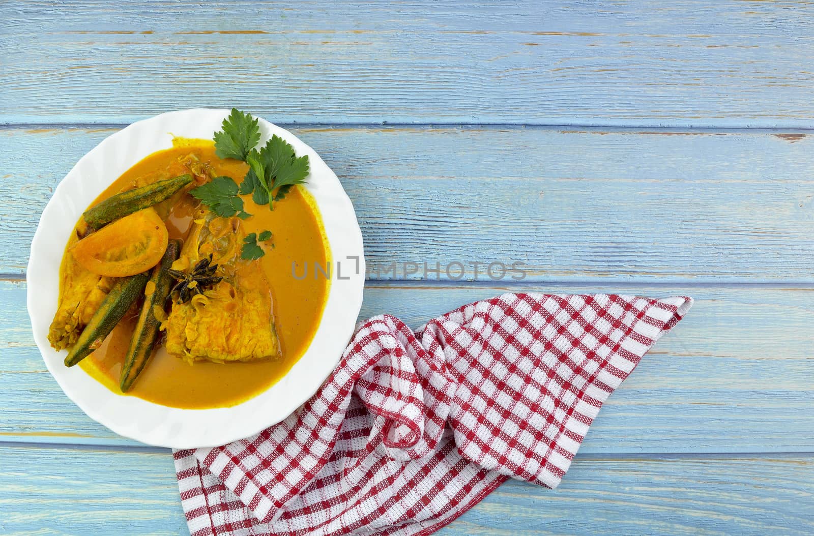 Spicy and tasty fish curry dish, Traditional Malaysian cuisine. Selective focus.