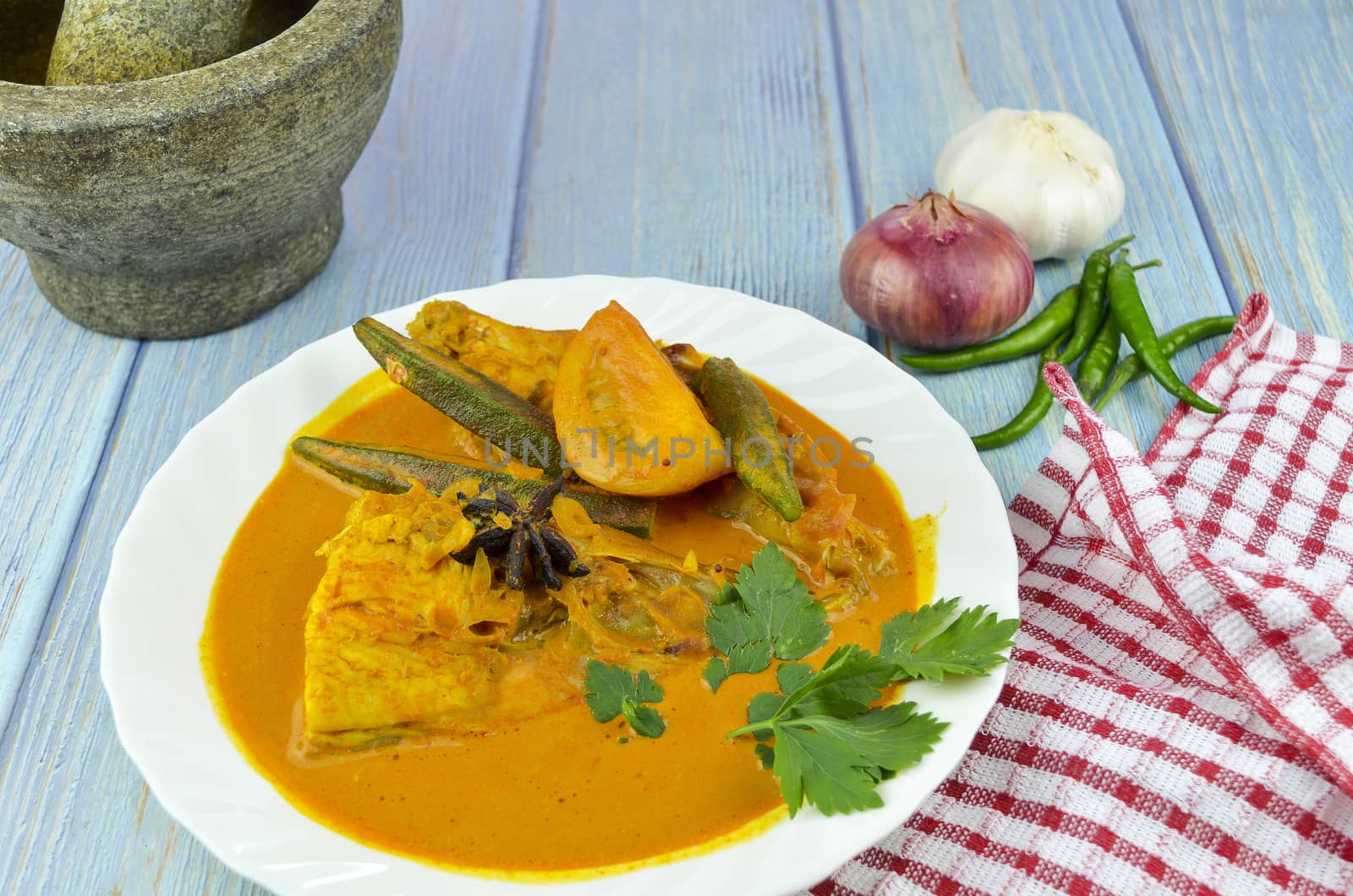 Spicy and tasty fish curry dish, Traditional Malaysian cuisine. Selective focus.