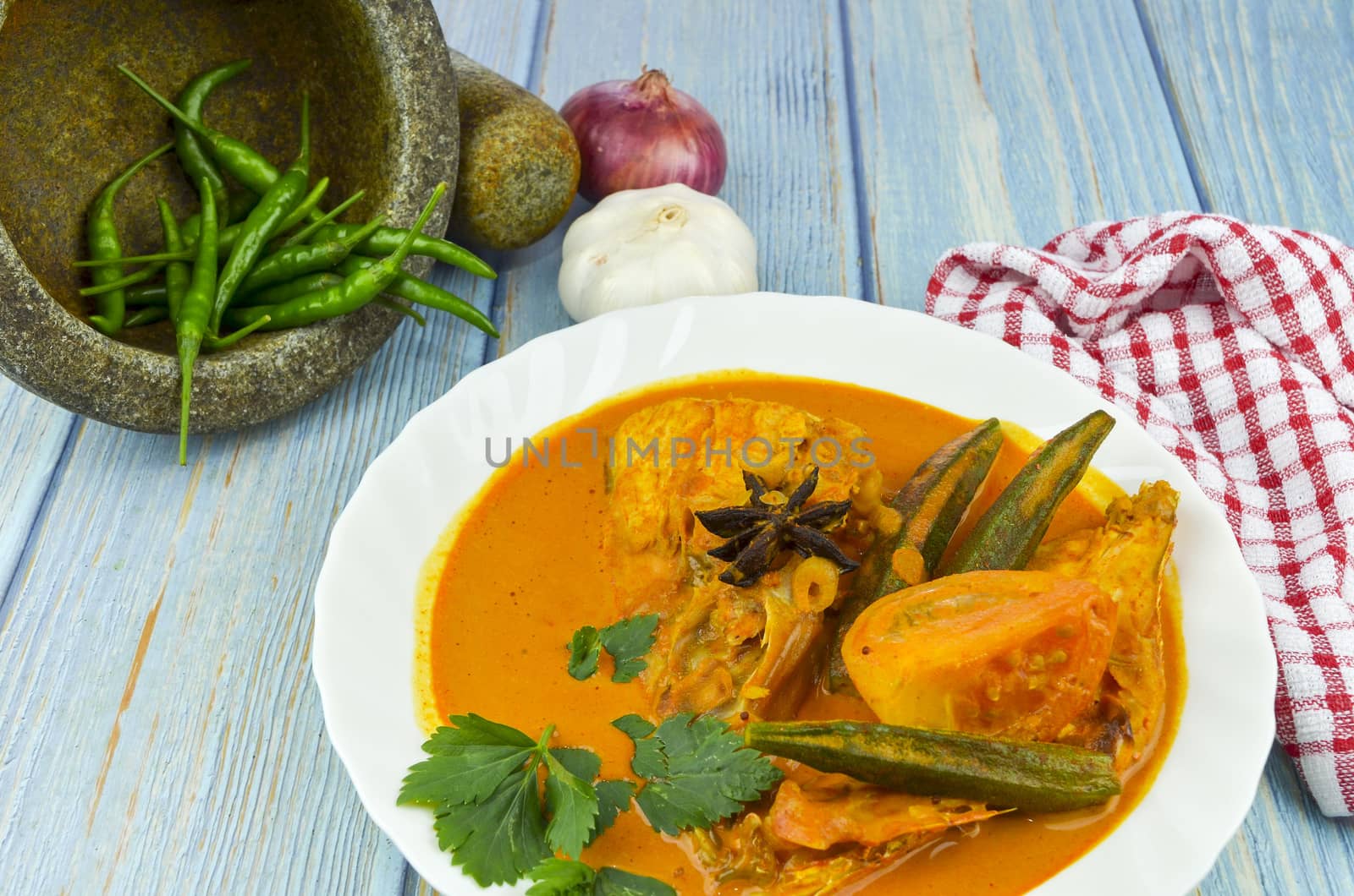 Spicy and tasty fish curry dish, Traditional Malaysian cuisine. Selective focus.