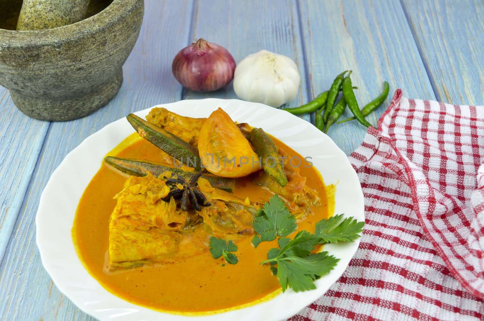 Spicy and tasty fish curry dish, Traditional Malaysian cuisine. Selective focus.