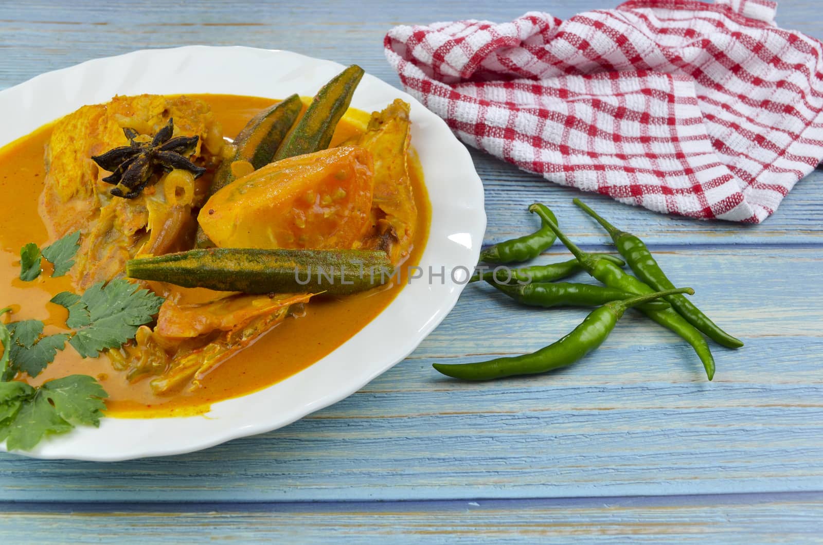 Spicy and tasty fish curry dish, Traditional Malaysian cuisine. Selective focus.