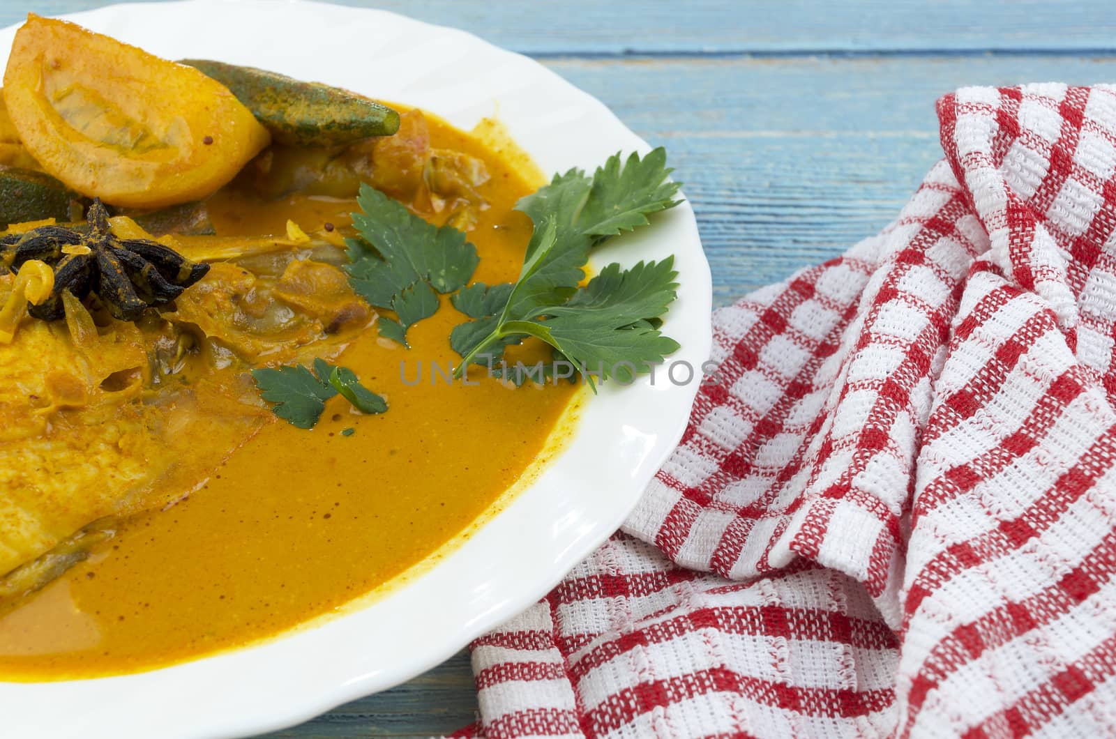 Spicy and tasty fish curry dish, Traditional Malaysian cuisine. Selective focus.