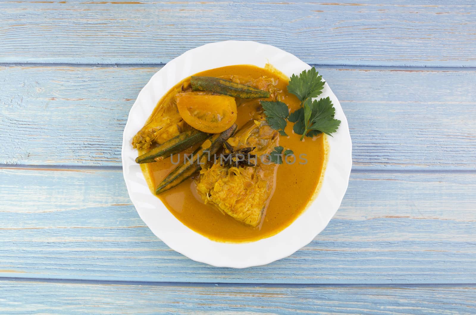 Spicy and tasty fish curry dish, Traditional Malaysian cuisine. Selective focus.