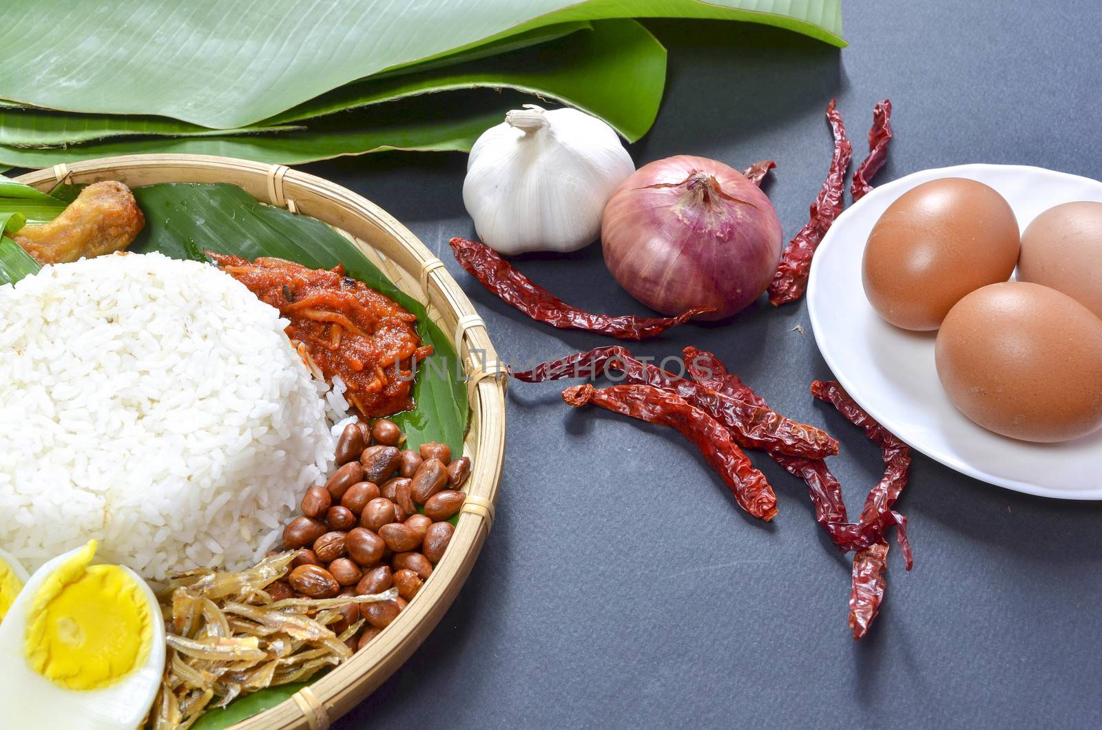 Nasi Lemak is a commonly found food in Malaysia, Brunei and Singapore. It is also an unofficial national food in Malaysia. Selective focus.