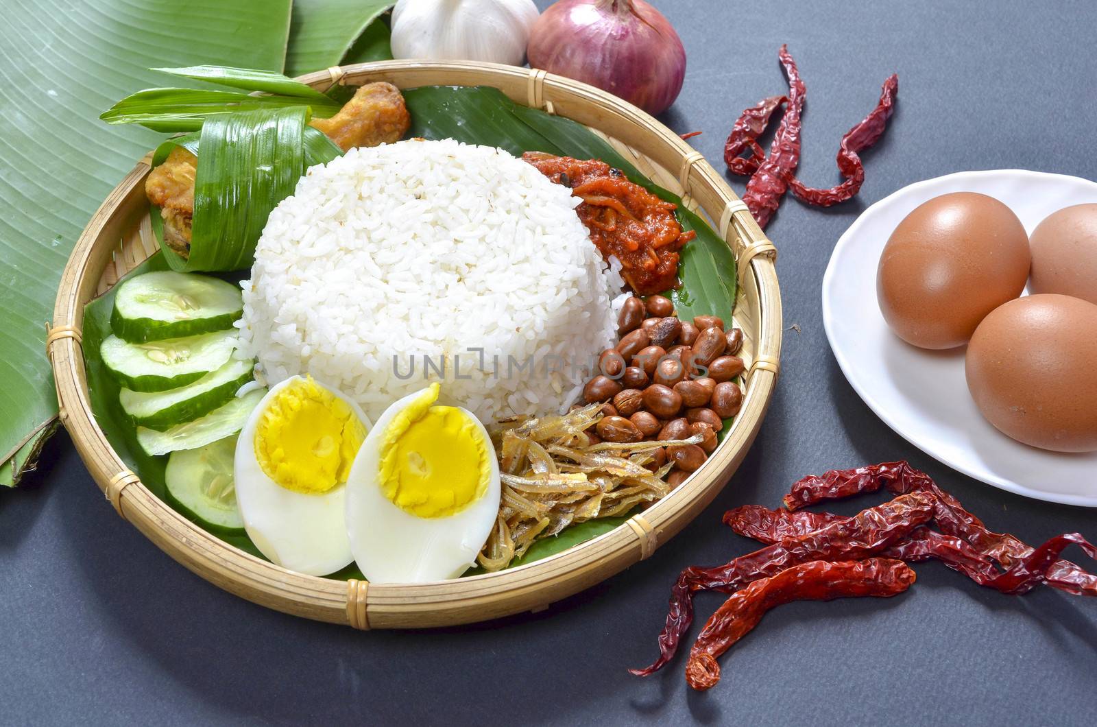 Nasi Lemak is a commonly found food in Malaysia, Brunei and Singapore. It is also an unofficial national food in Malaysia. Selective focus.