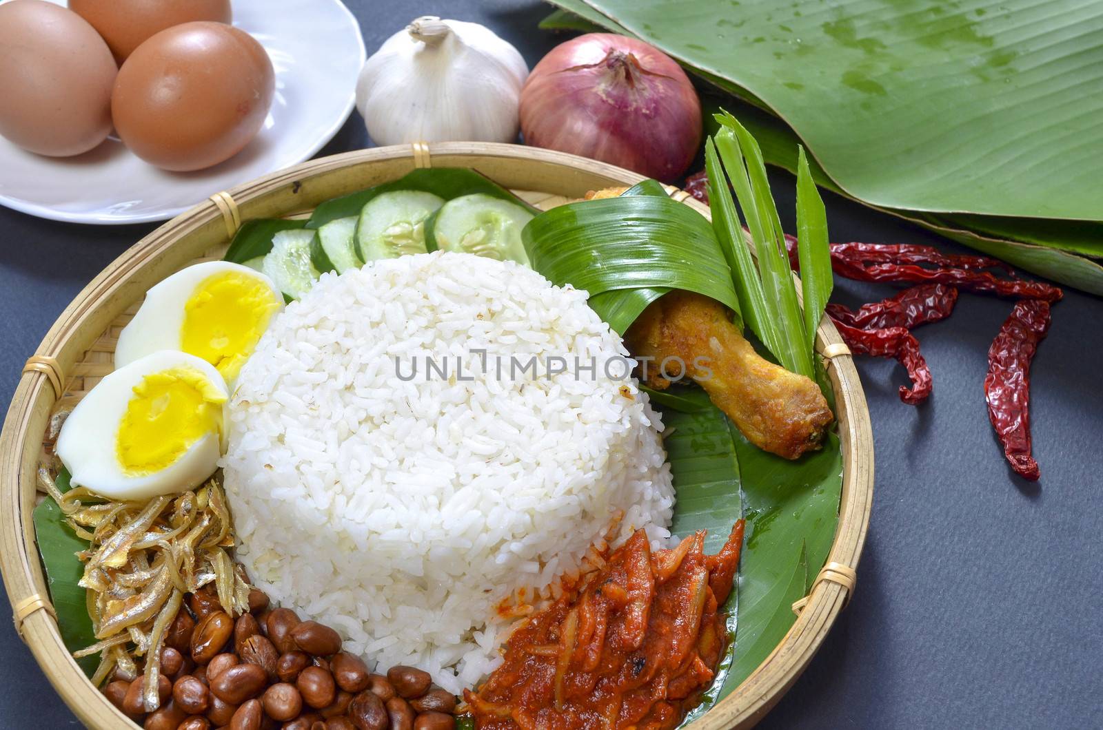 Nasi Lemak is a commonly found food in Malaysia, Brunei and Singapore. It is also an unofficial national food in Malaysia. Selective focus.