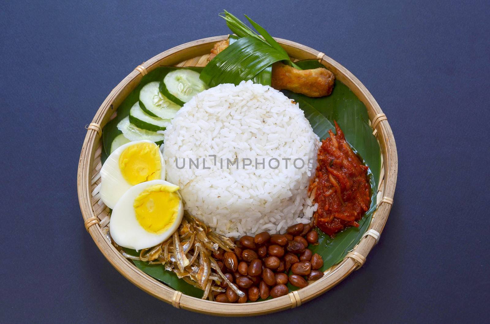 Nasi Lemak is a commonly found food in Malaysia, Brunei and Singapore. It is also an unofficial national food in Malaysia. Selective focus.