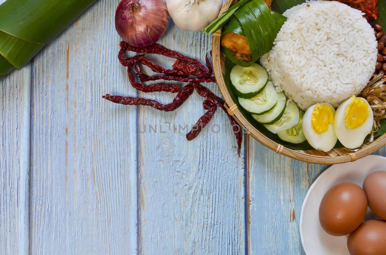 Nasi Lemak is a commonly found food in Malaysia, Brunei and Singapore. It is also an unofficial national food in Malaysia. Selective focus.