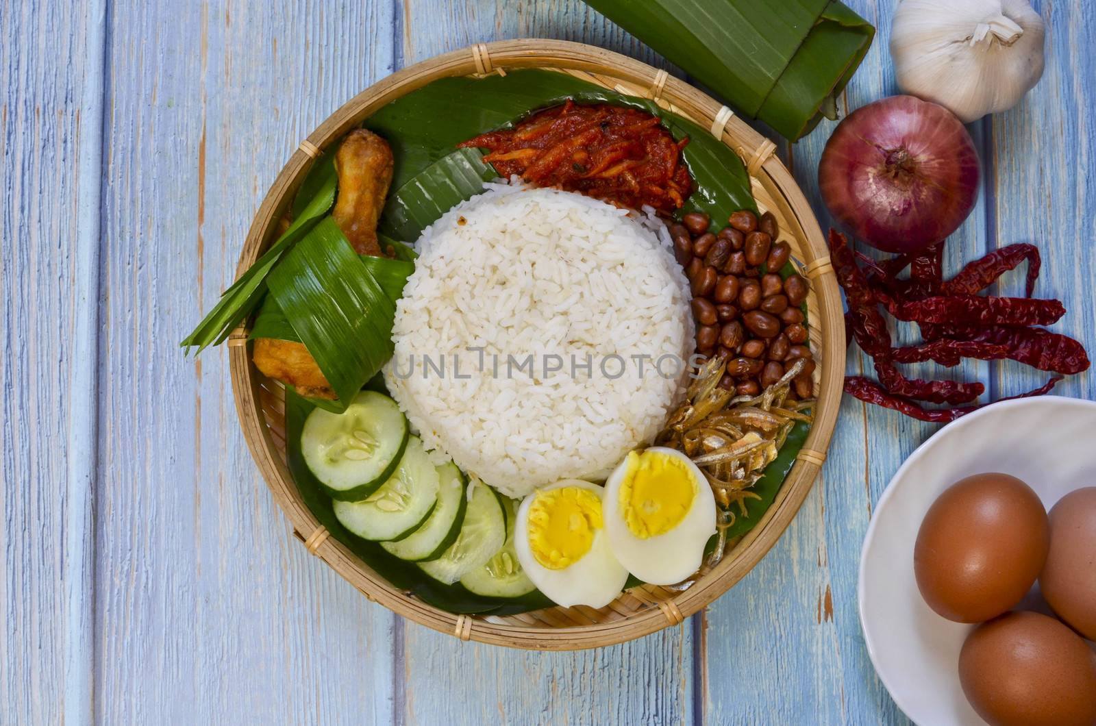 Nasi Lemak is a commonly found food in Malaysia, Brunei and Singapore. It is also an unofficial national food in Malaysia. Selective focus.