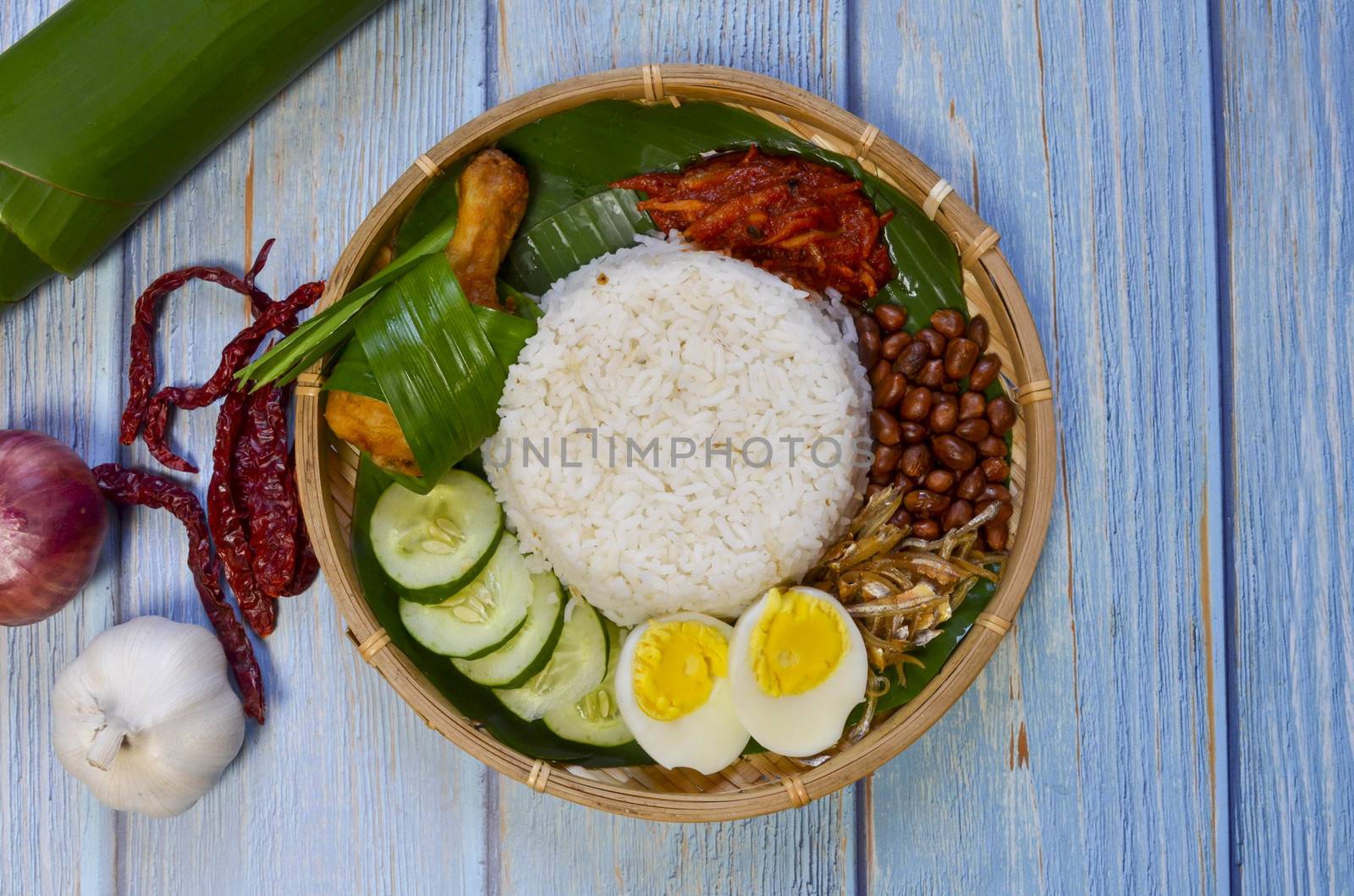 Nasi Lemak is a commonly found food in Malaysia, Brunei and Singapore. It is also an unofficial national food in Malaysia. Selective focus.