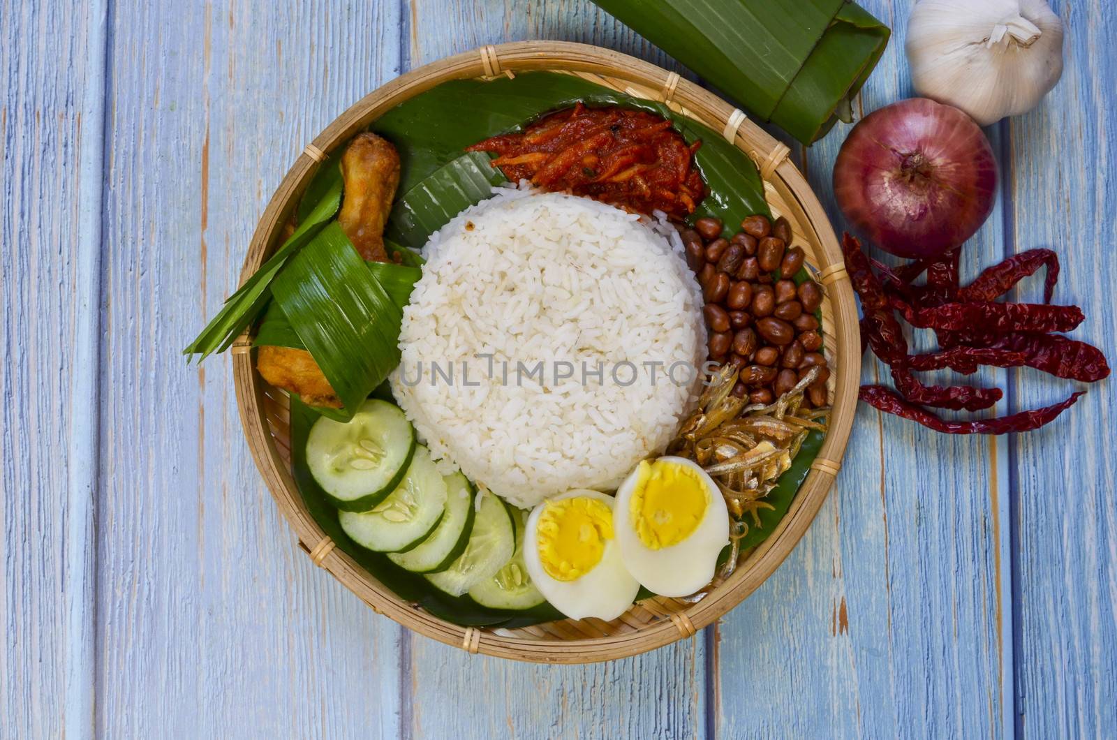 Nasi Lemak is a commonly found food in Malaysia, Brunei and Singapore. It is also an unofficial national food in Malaysia. Selective focus.