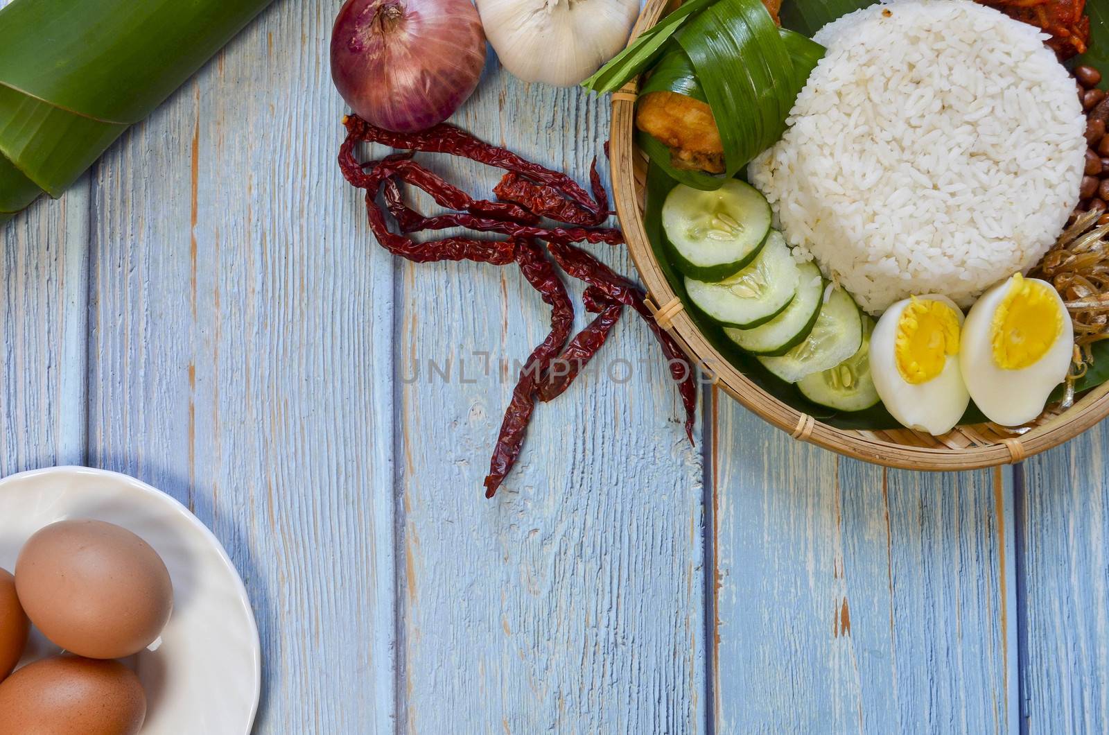 Nasi Lemak is a commonly found food in Malaysia, Brunei and Singapore. It is also an unofficial national food in Malaysia. Selective focus.