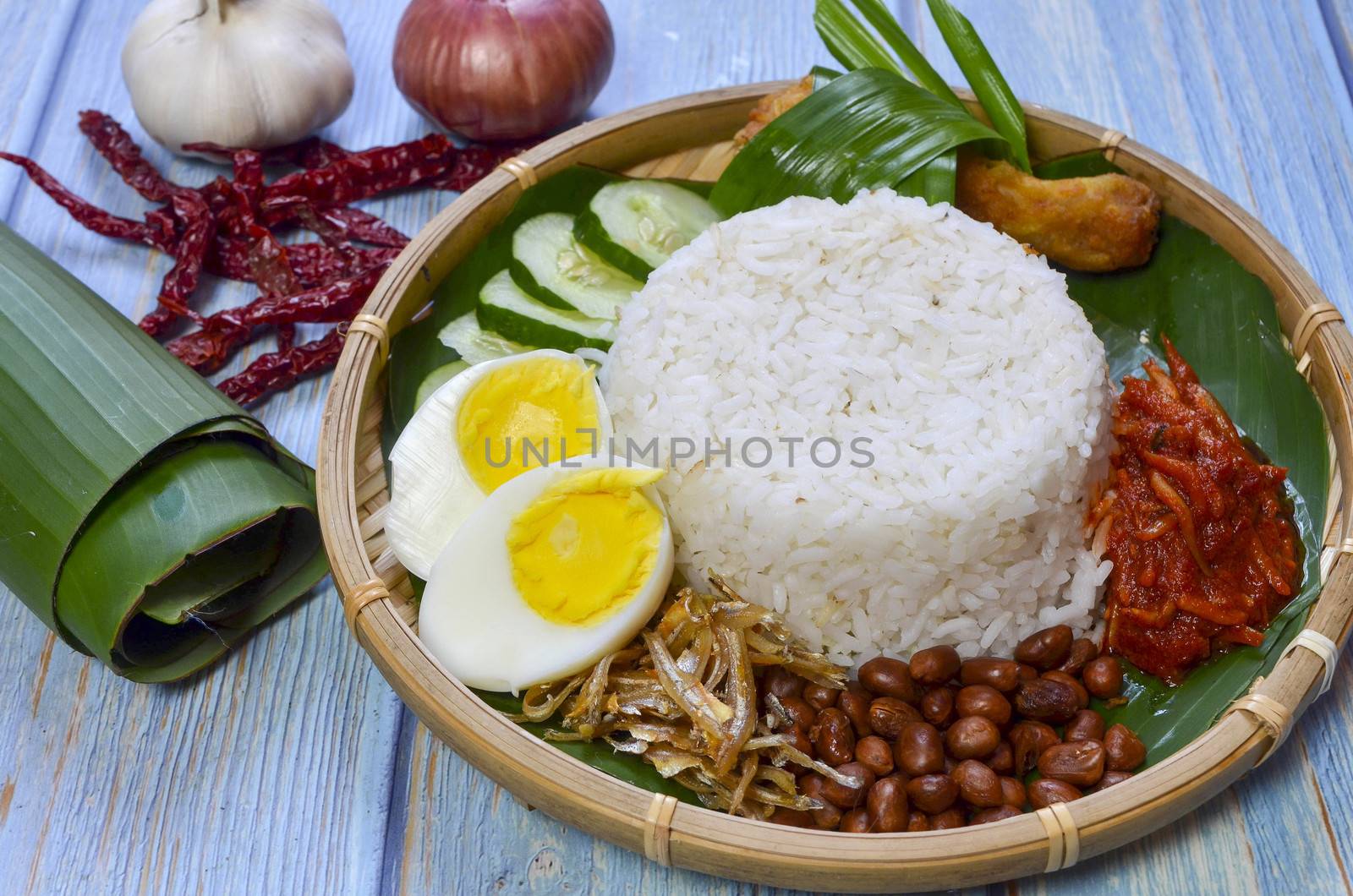 Nasi Lemak is a commonly found food in Malaysia, Brunei and Singapore. It is also an unofficial national food in Malaysia. Selective focus.