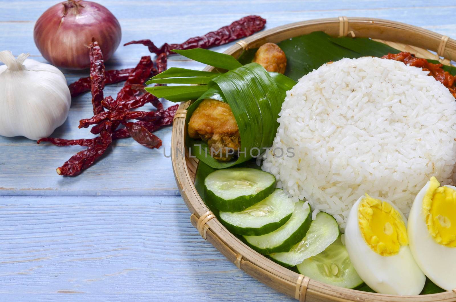 Nasi Lemak is a commonly found food in Malaysia, Brunei and Singapore. It is also an unofficial national food in Malaysia. Selective focus.