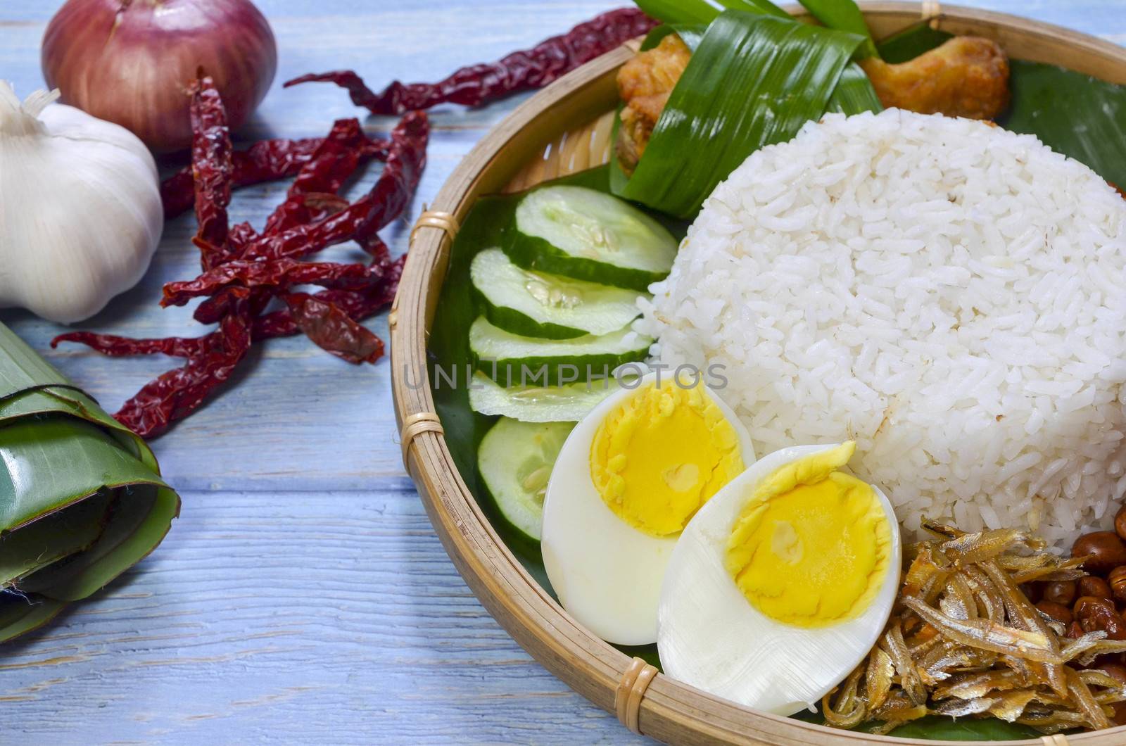 Nasi Lemak is a commonly found food in Malaysia, Brunei and Singapore. It is also an unofficial national food in Malaysia. Selective focus.