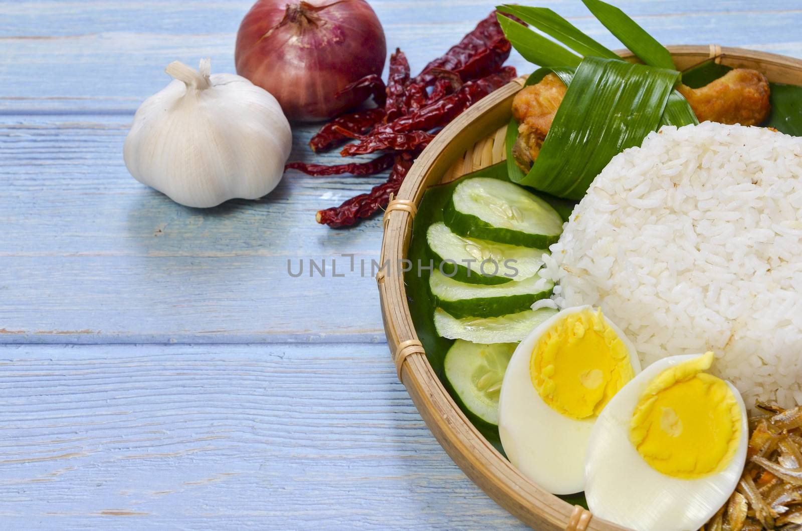 Nasi Lemak is a commonly found food in Malaysia, Brunei and Singapore. It is also an unofficial national food in Malaysia. Selective focus.