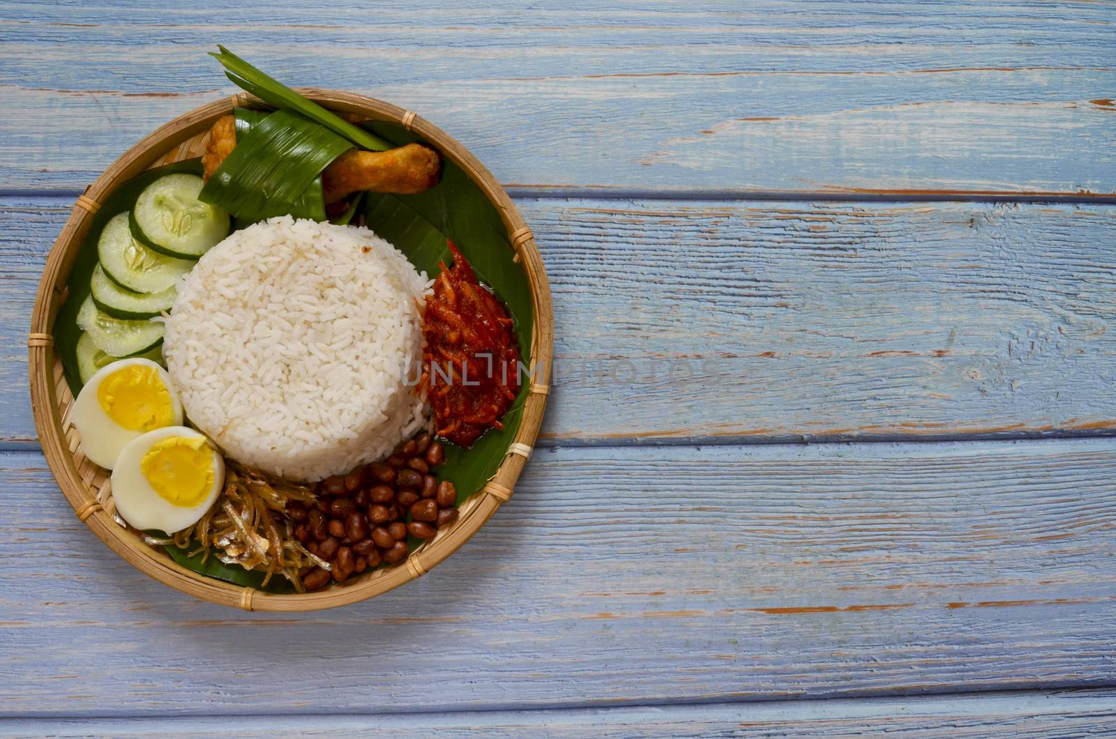 Nasi Lemak is a commonly found food in Malaysia, Brunei and Singapore. It is also an unofficial national food in Malaysia. Selective focus.