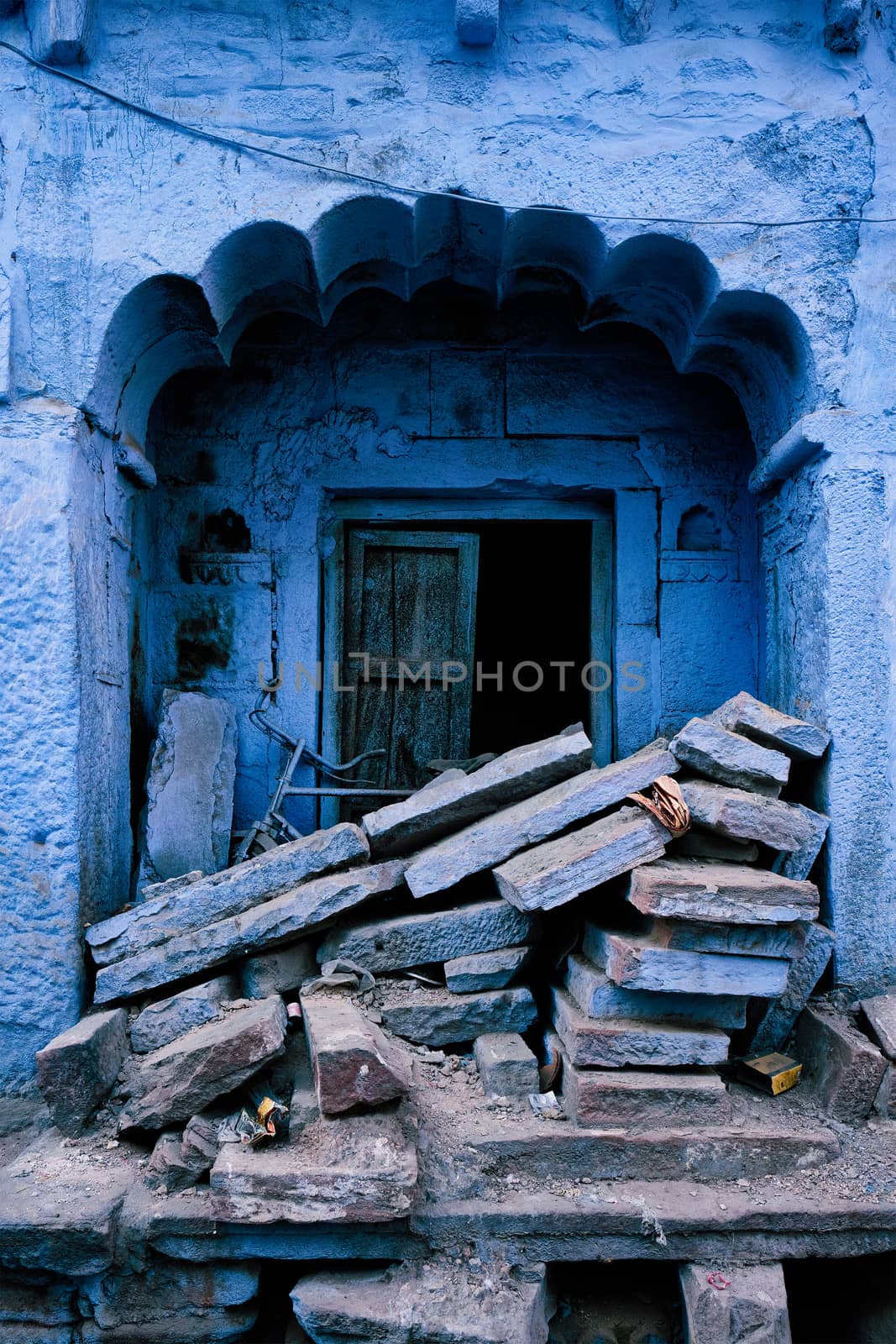 Blue house facade in streets of of Jodhpur, also known as Blue City due to the vivid blue-painted Brahmin houses, Jodhpur, Rajasthan, India