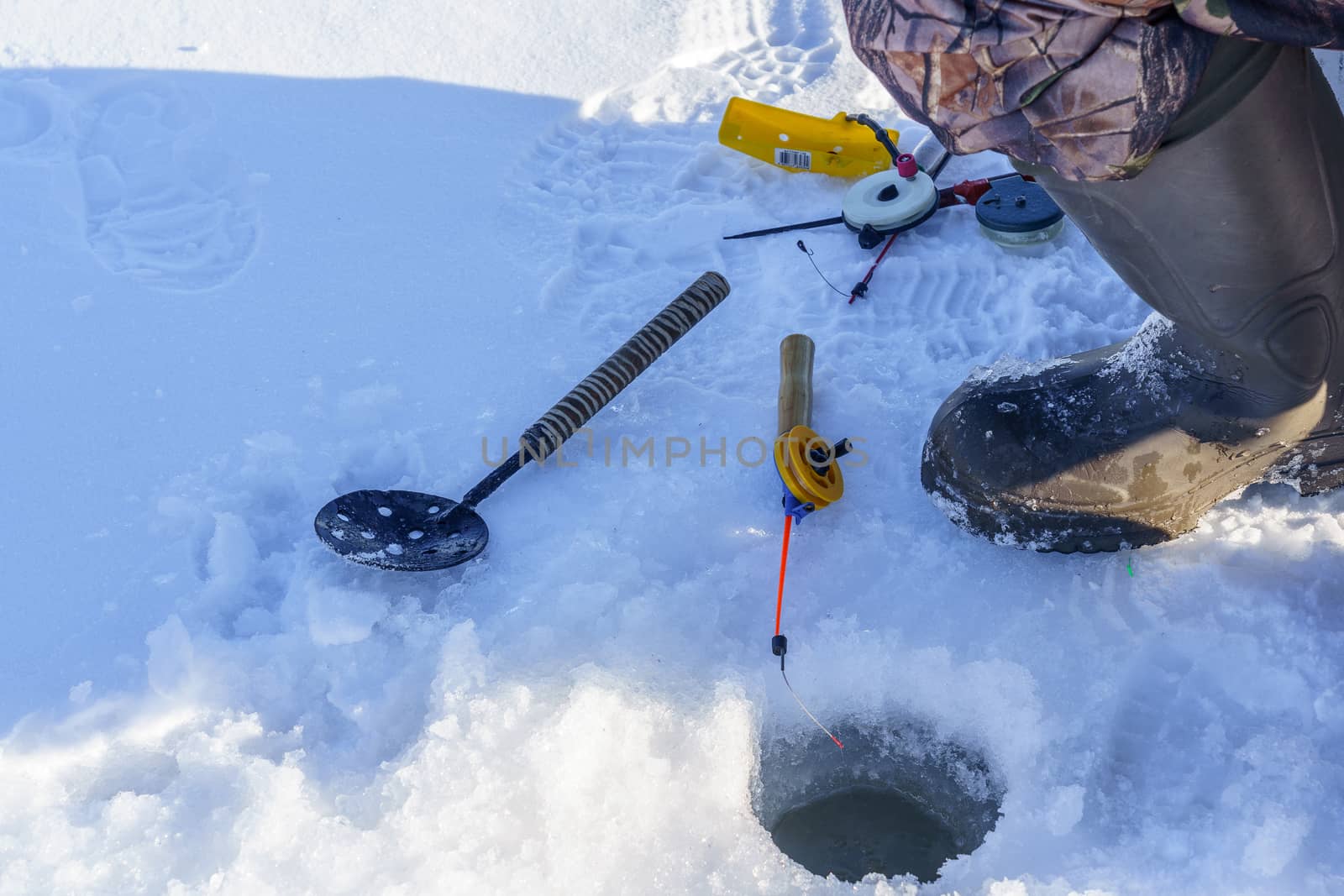 hole in the ice for fishing rod and other accessories for fishing by VADIM