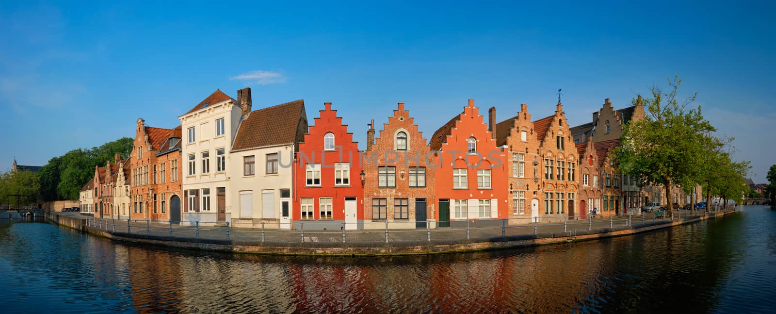 Typical Belgian cityscape Europe tourism concept - panorama of canal and old houses on sunset. Bruges (Brugge), Belgium