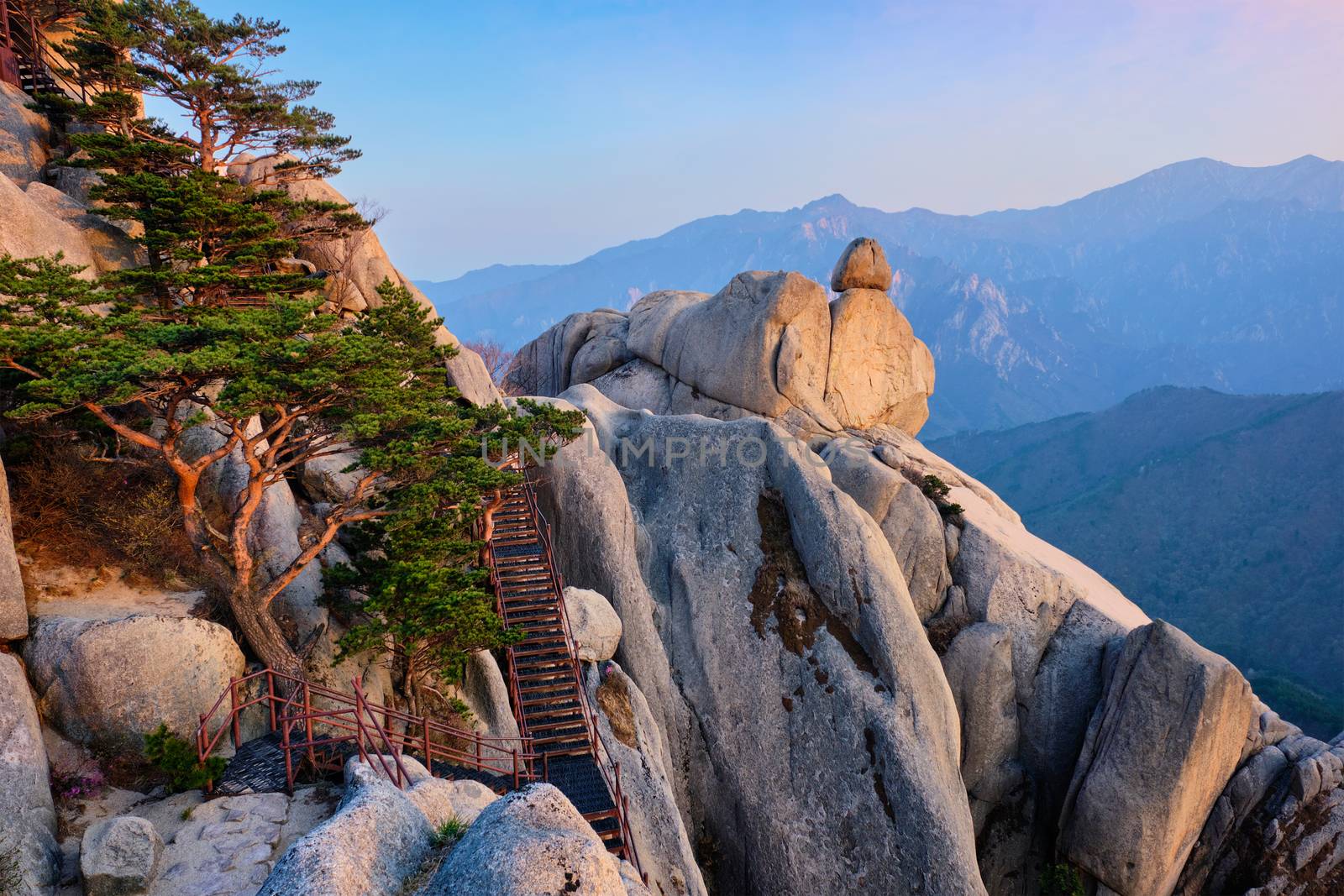 View of stones and rock formations from Ulsanbawi rock peak on sunset with staircase. Seoraksan National Park, South Corea