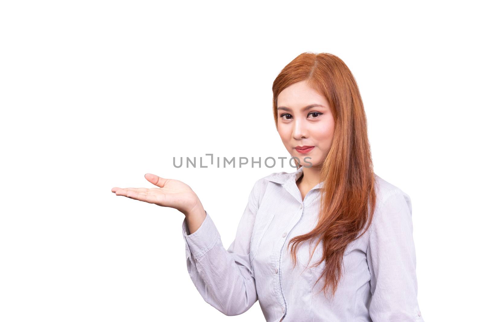 cheerful Asian woman presenting an empty copy space on the open hand palm isolated on white background with clipping path, advertising presentation for product. side view