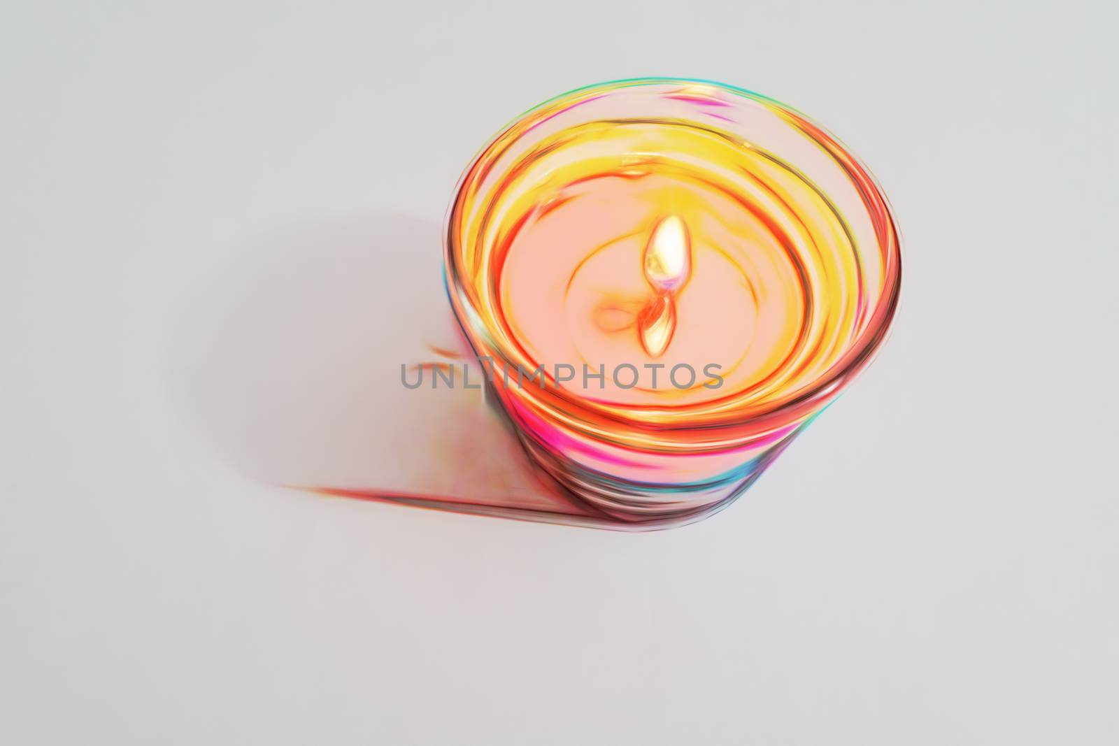 burning candle on a white background