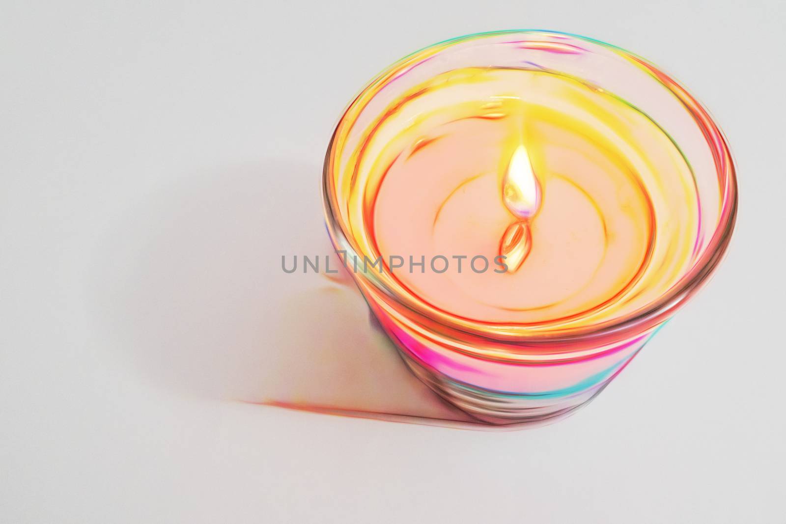 burning candle on a white background