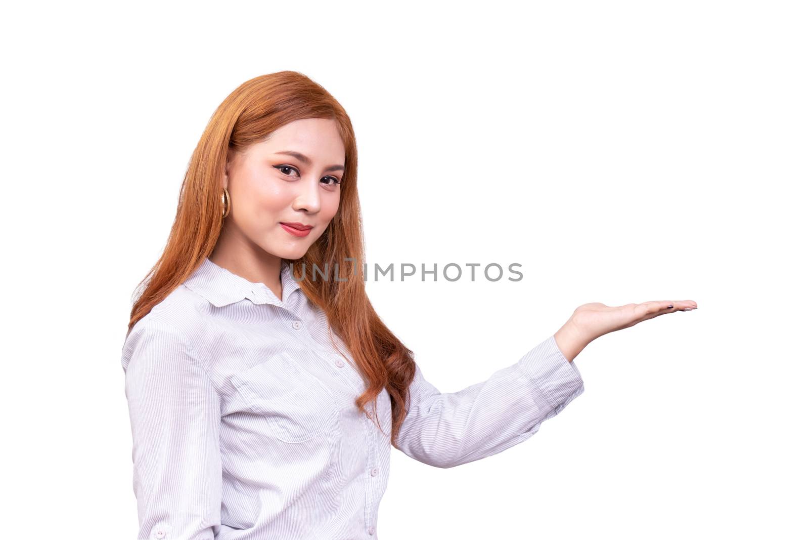 cheerful Asian woman presenting an empty copy space on the open hand palm isolated on white background with clipping path, advertising presentation for product. side view by asiandelight