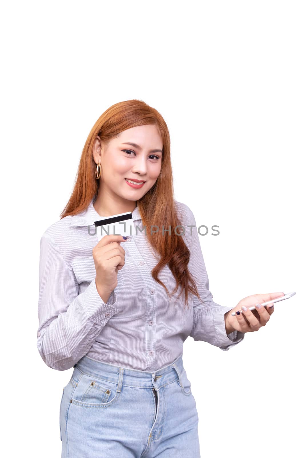 smiling Asian woman in casual shirt holding mobile phone and showing credit card for shopping online while making orders via the internet. studio shoot ,isolated on white background with clipping path