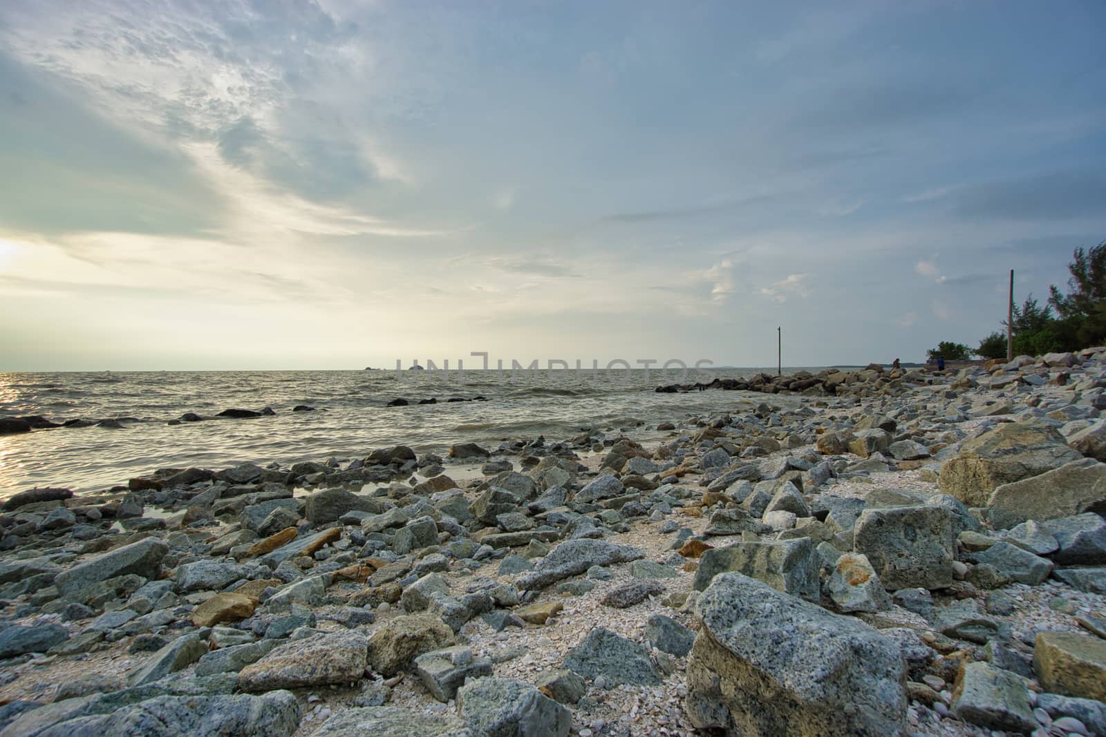 Peaceful beach view and waves during sunset at Jeram, Kuala Selangor Malaysia