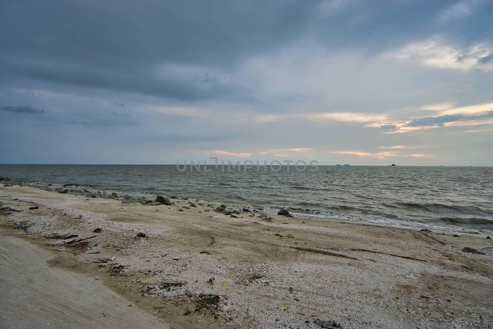 Peaceful beach view and waves during sunset at Jeram, Kuala Selangor Malaysia