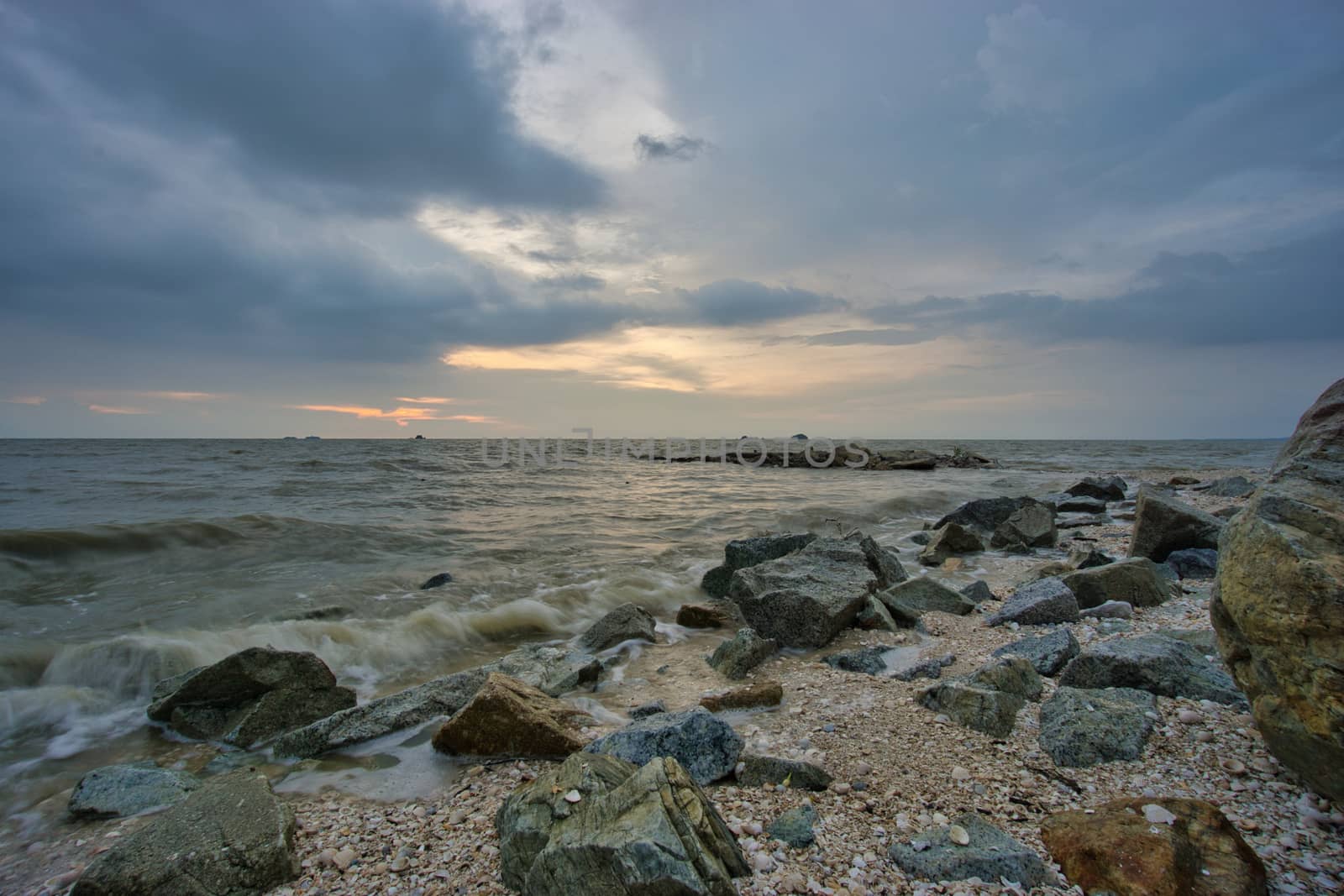 Peaceful beach view and waves during sunset at Jeram, Kuala Selangor Malaysia