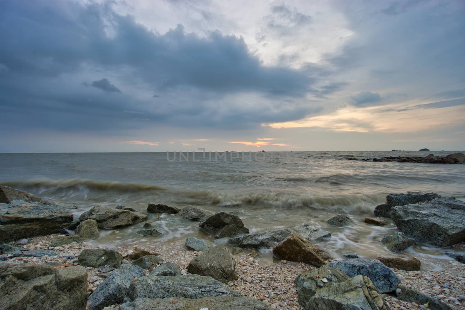 Peaceful beach view and waves during sunset at Jeram, Kuala Selangor Malaysia