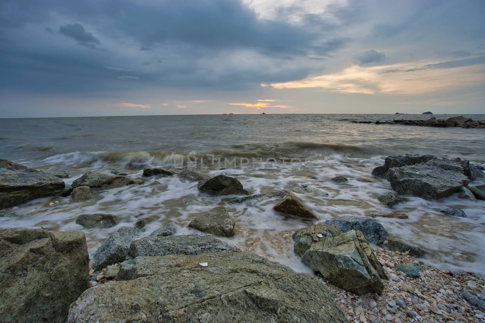 Peaceful beach view and waves during sunset at Jeram, Kuala Selangor Malaysia