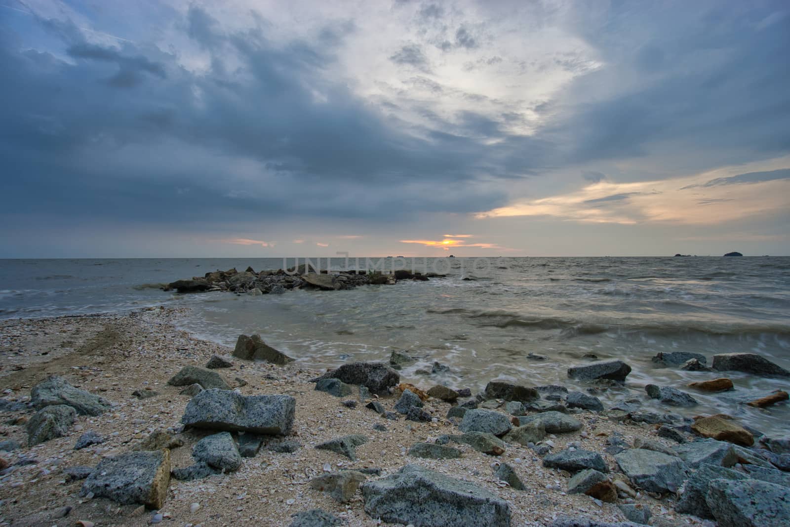 Peaceful beach view and waves during sunset at Jeram, Kuala Selangor Malaysia