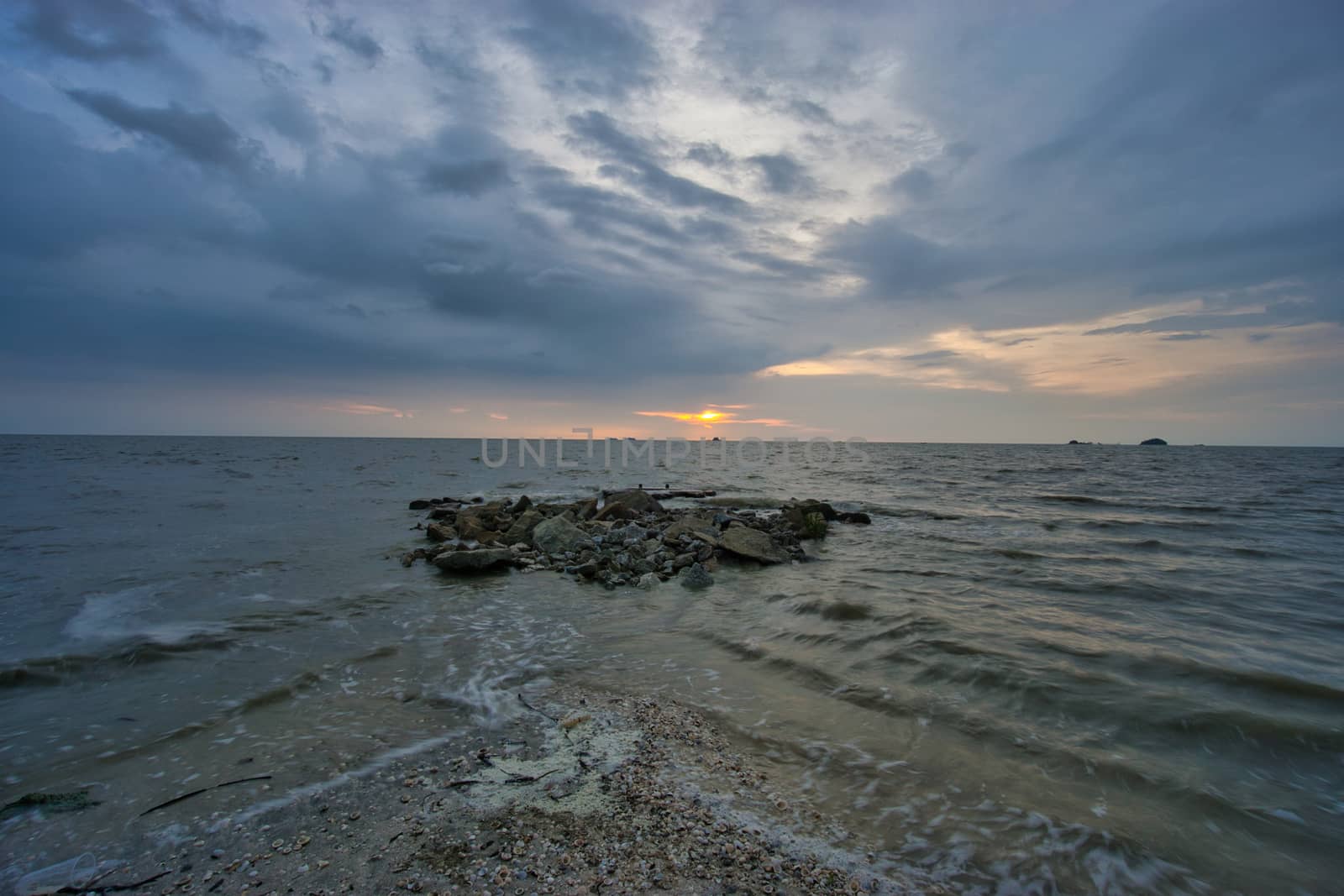 Peaceful beach view and waves during sunset at Jeram, Kuala Selangor Malaysia