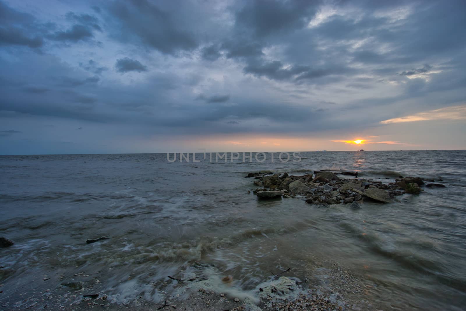 Peaceful beach view and waves during sunset at Jeram, Kuala Selangor Malaysia