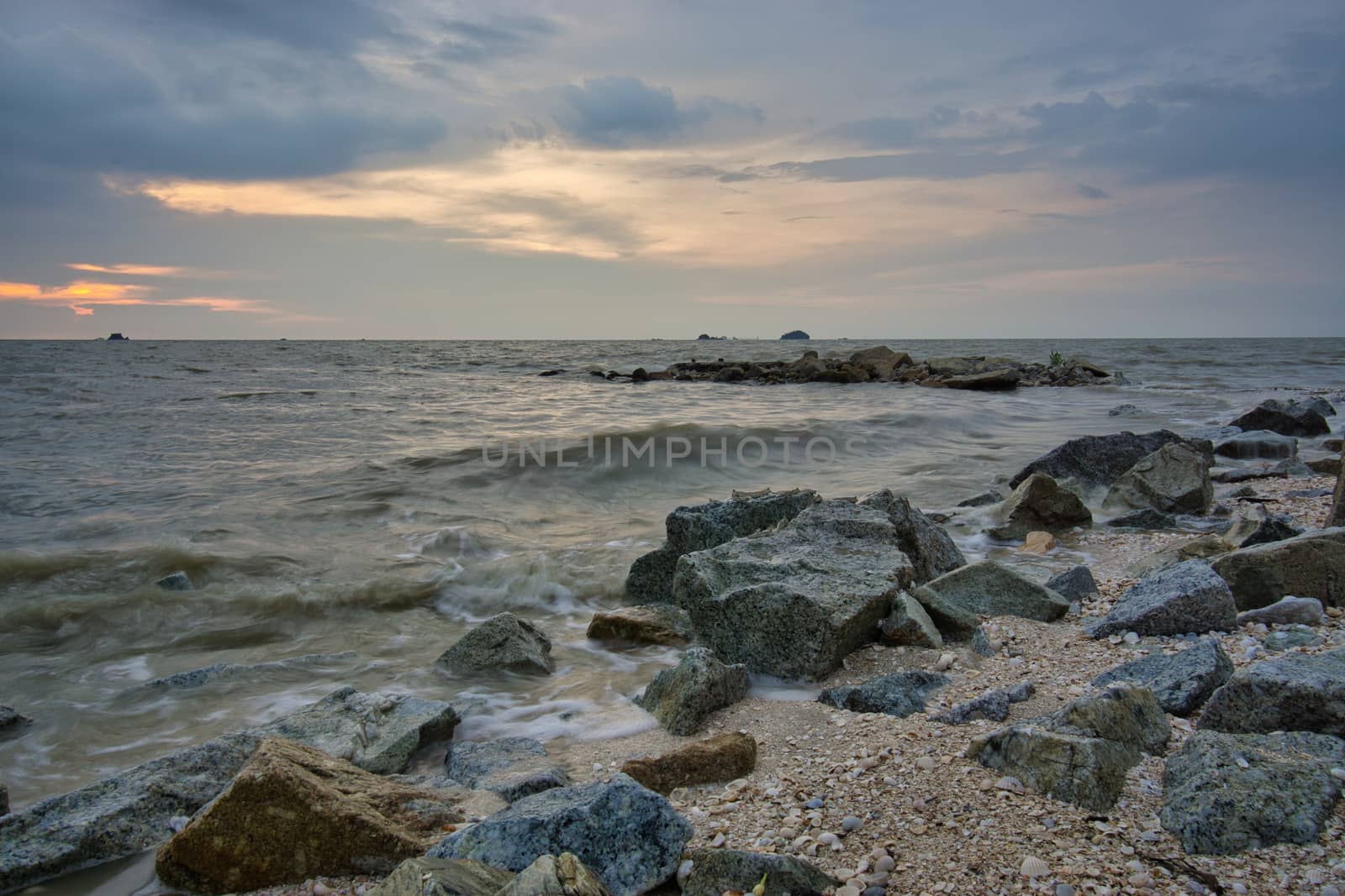 Peaceful beach view and waves during sunset at Jeram, Kuala Selangor Malaysia