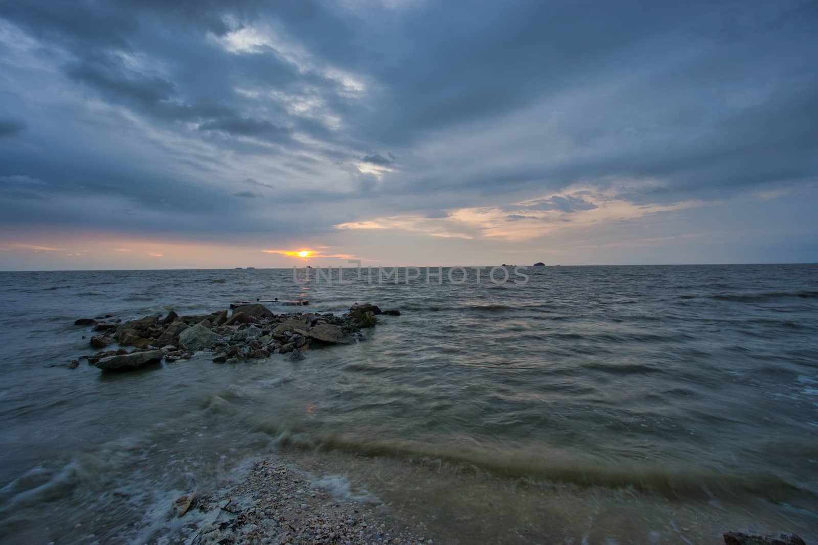 Peaceful beach view and waves during sunset at Jeram, Kuala Selangor Malaysia