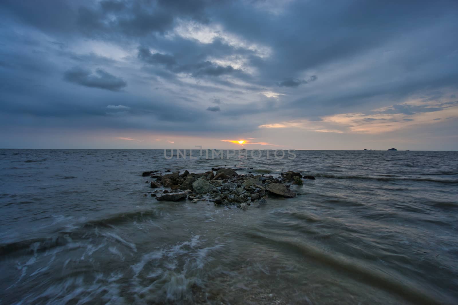 Peaceful beach view and waves during sunset at Jeram, Kuala Selangor Malaysia