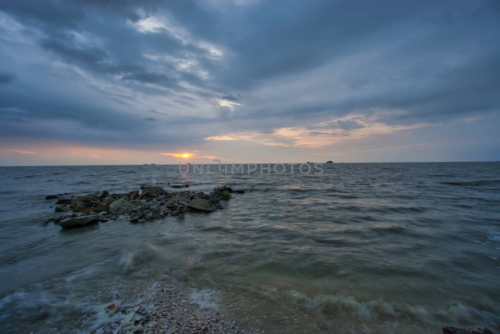 Peaceful beach view and waves during sunset at Jeram, Kuala Selangor Malaysia