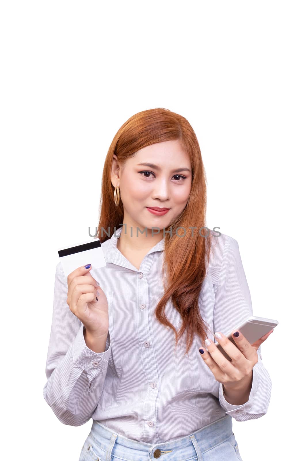 smiling Asian woman in casual shirt holding mobile phone and showing credit card for shopping online while making orders via the internet. studio shoot ,isolated on white background with clipping path