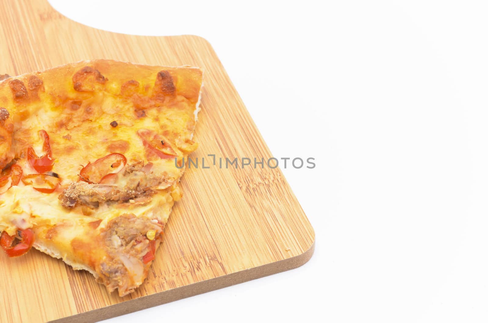 Pizza slice on over white background. Selective focus.