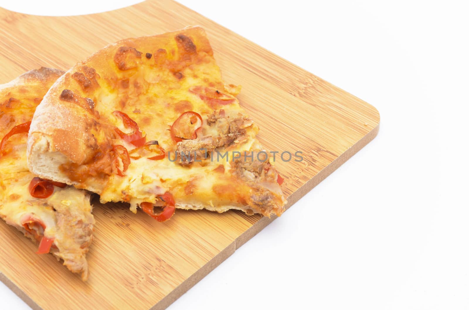 Pizza slice on over white background. Selective focus.