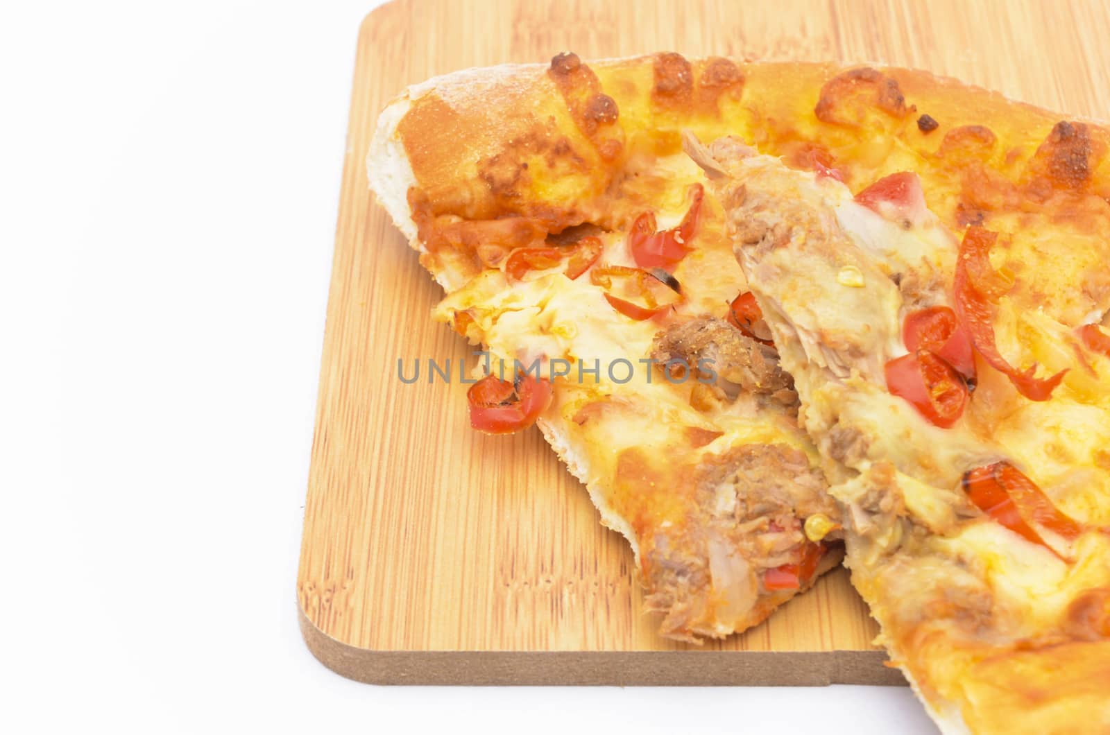 Pizza slice on over white background. Selective focus.