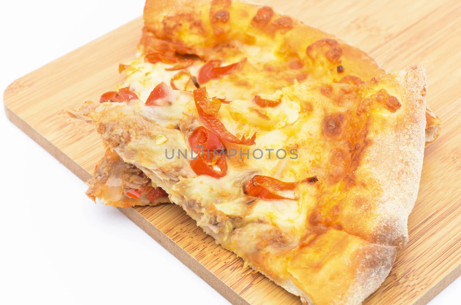 Pizza slice on over white background. Selective focus.