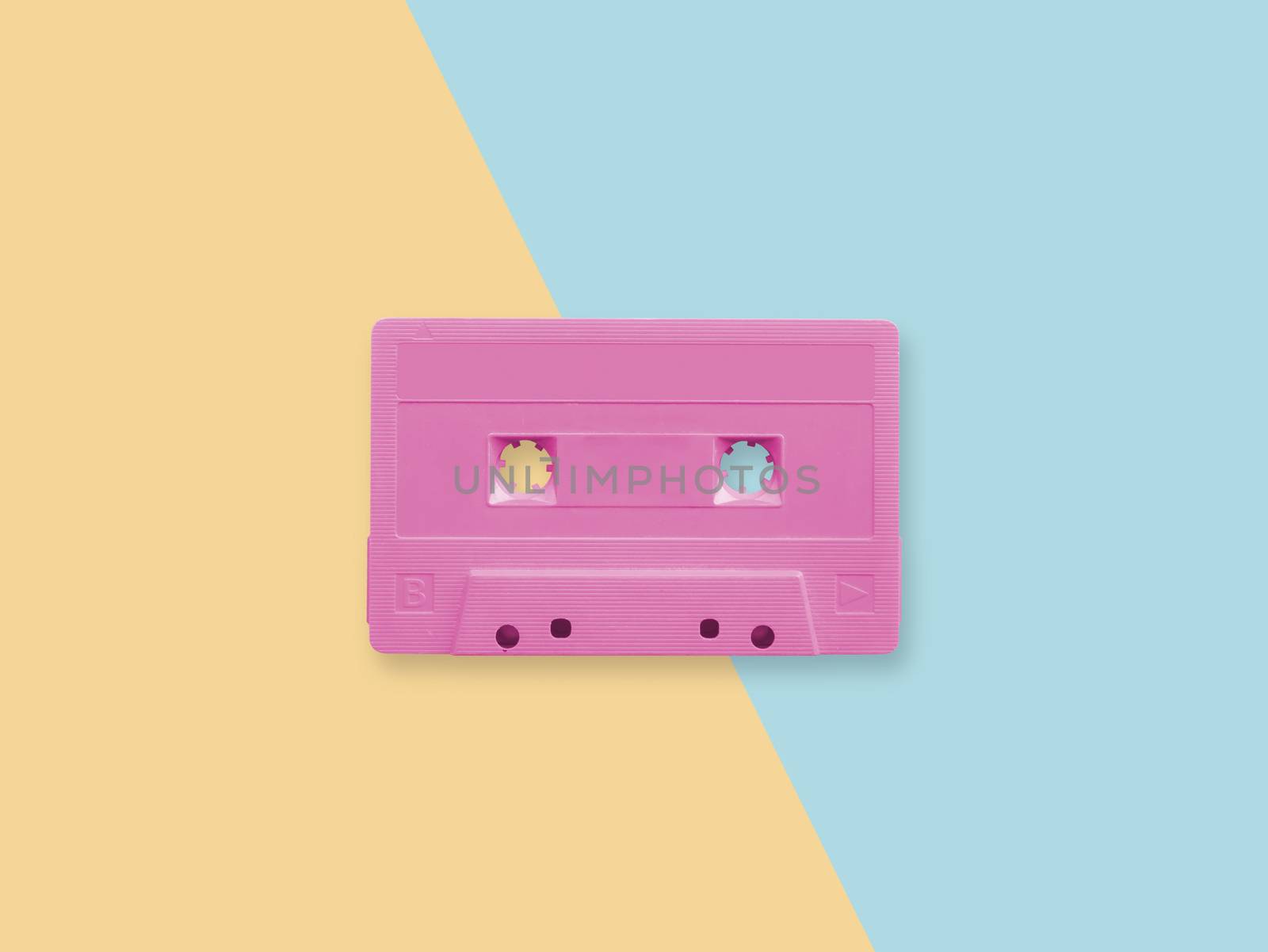 retro pink cassette tape on a pastel duotone background 