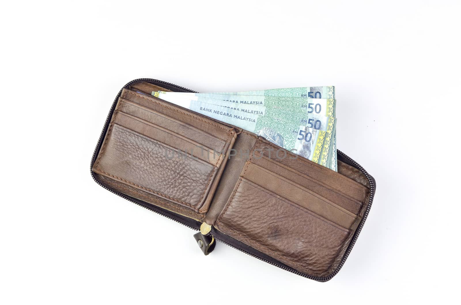 Malaysia bank note with leather purse on white background.